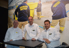 Pouring concrete in the background, the trade fair team of Verkade Beton in the foreground